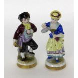 ''TWO CHILDREN Volkstedt, Thuringia Colourfully decorated porcelain figures with tap, jug