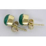 ''A PAIR OF STUD EARRINGS 585/000 yellow gold with emerald cabochons, approx. 5 x 6 mm.