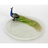 ''A PEACOCK PLATE Meissen circa 1898/1900. Three-dimensional and polychrome painted peacock