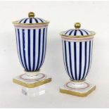 A PAIR OF ELEGANT COVERED VASES probably Paris, 20th century Porcelain with blue-and-white