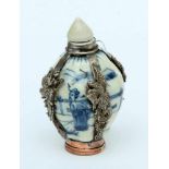 ''A SNUFF BOTTLE WITH STOPPER China, 19th century Porcelain with blue painting and