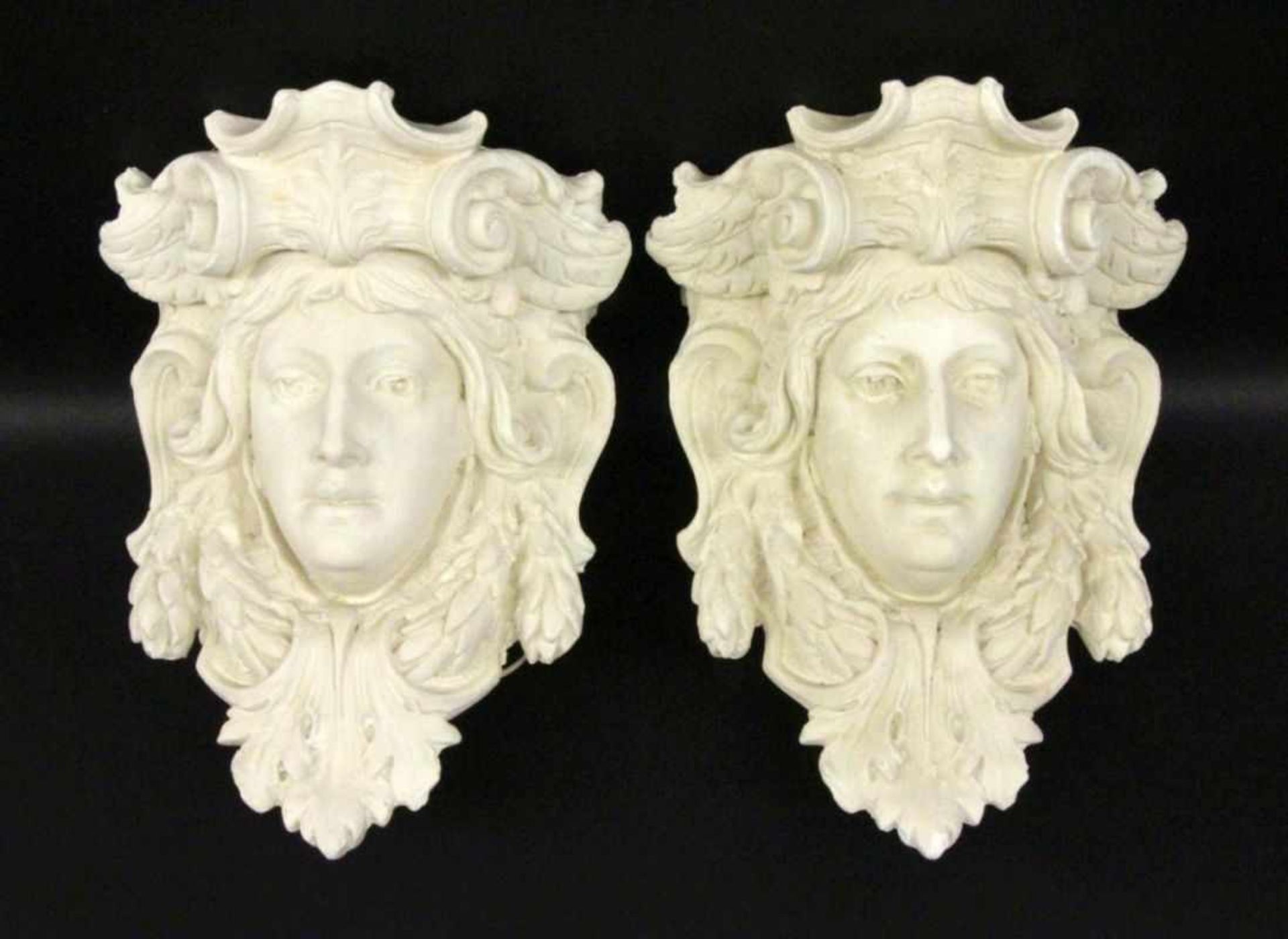 ''A PAIR OF ANTIQUE STILY WALL SCONCES Plaster in the shape of ancient heads. 50 cm