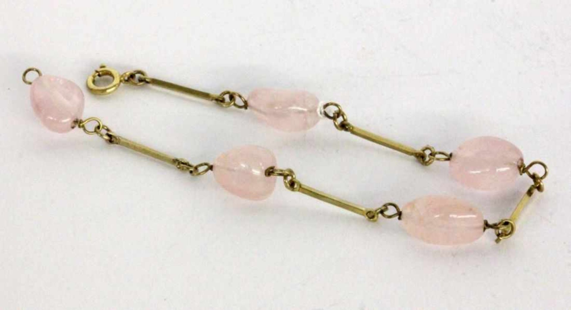 ''A BRACELET 333/000 yellow gold with rose quartz. 17 cm long, gross weight approx. 6.5