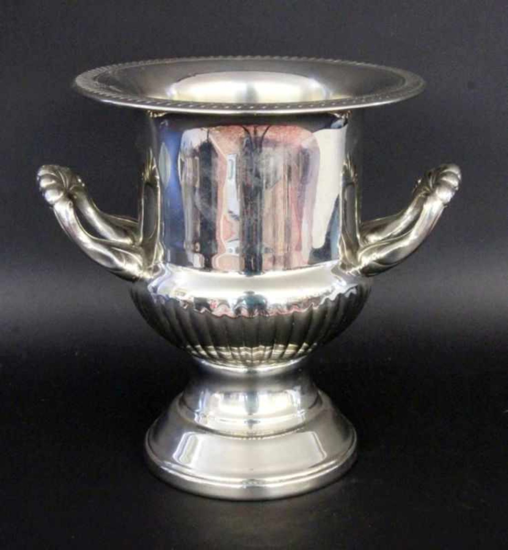 A CHAMPAGNE COOLER Silver-plated metal. Crater form with handles. 27 cm high