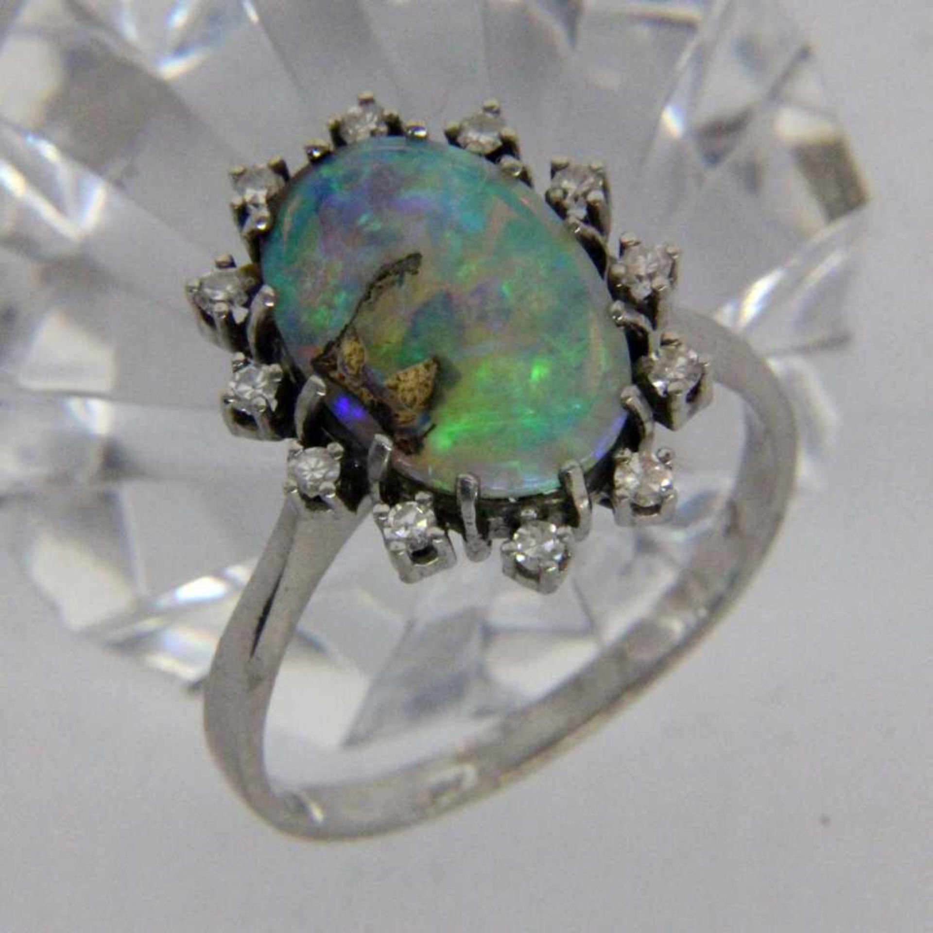 ''A LADIES RING 585/000 yellow gold with precious opal (solid opal with inclusions) and