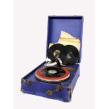 AN ORPHÉE TRAVEL GRAMMOPHONE 1920s In a box with 8 records. Condition: signs of wear and<