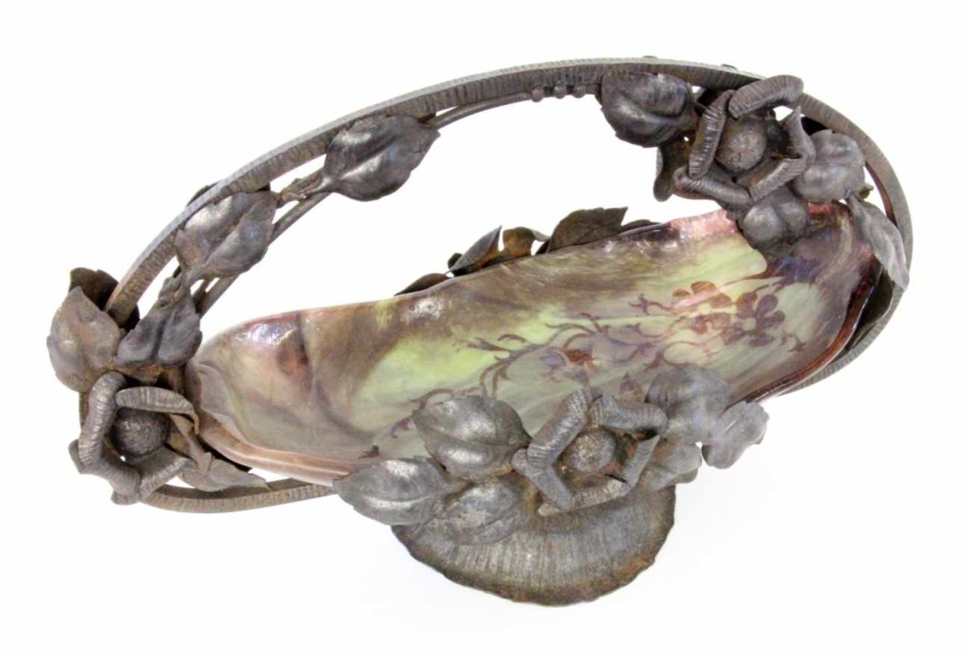 A DECORATIVE FRUIT BOWL Blackened iron frame with sculptural flowers. Inserted glass bowl