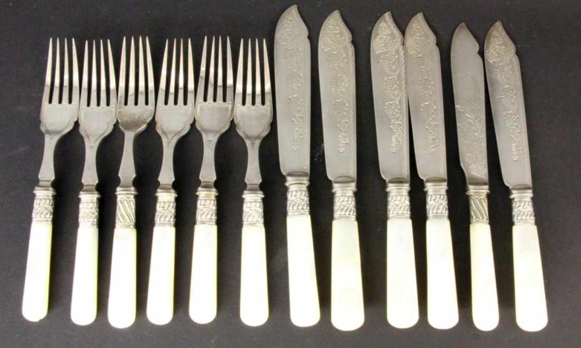 ''A SET OF FISH KNIVES AND FORKS, 12 pieces for 6 persons. Silver-plated metal with