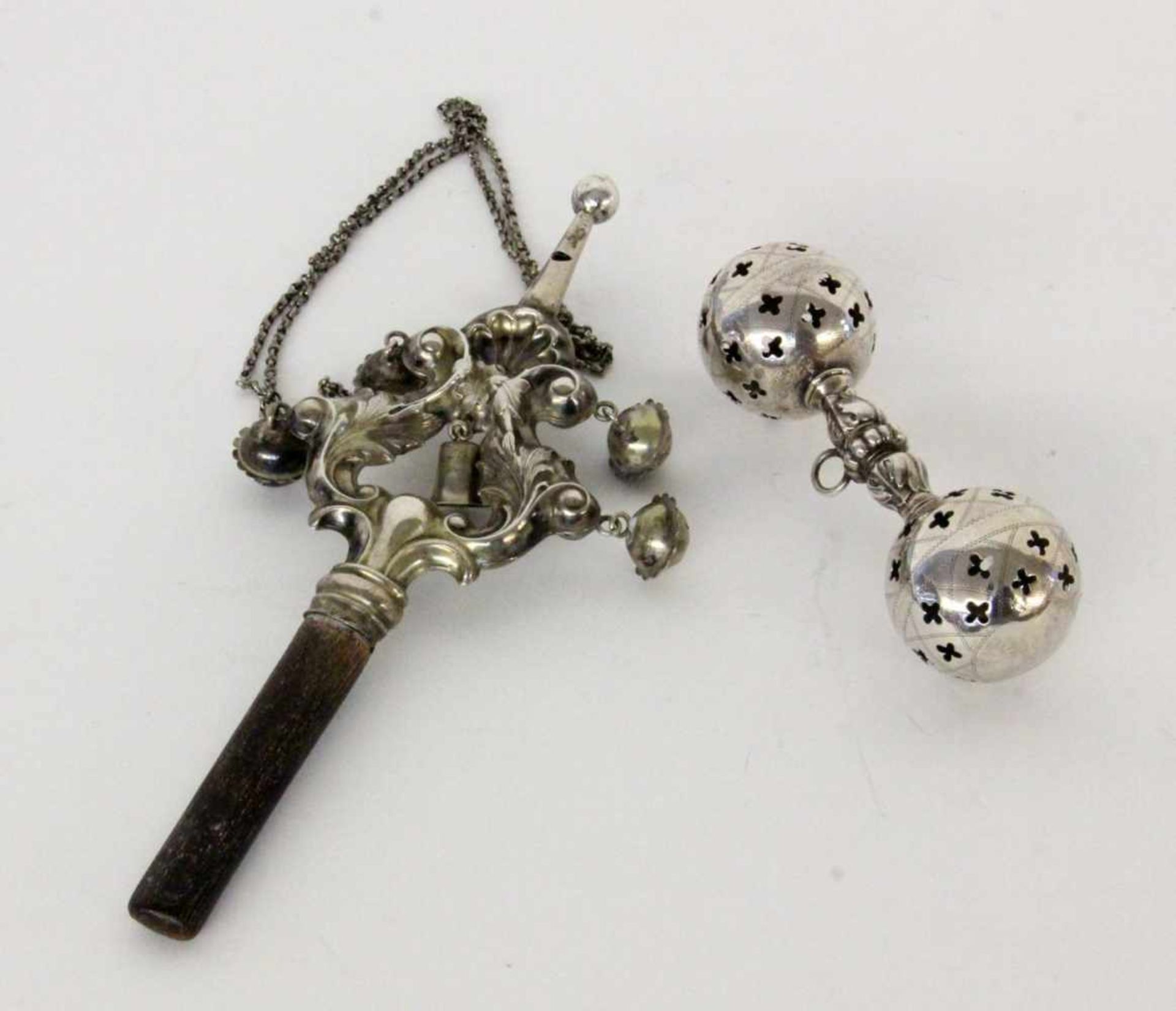 ''TWO OLD CHILDREN'S RATTLES, circa 1900 Silver-platedKeywords: toys''