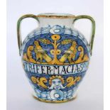 A TWIN-HANDLED VASE IN URBINO STYLE Italy Maiolica with coloured painting. 31 cm high.