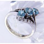 A LADIES RING 585/000 white gold with 3 blue zircons and brilliant cut diamonds. Ring size