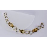 A BRACELET Silver, gold-plated with citrines. 18.5 cm long. Keywords: jewellery, piece of