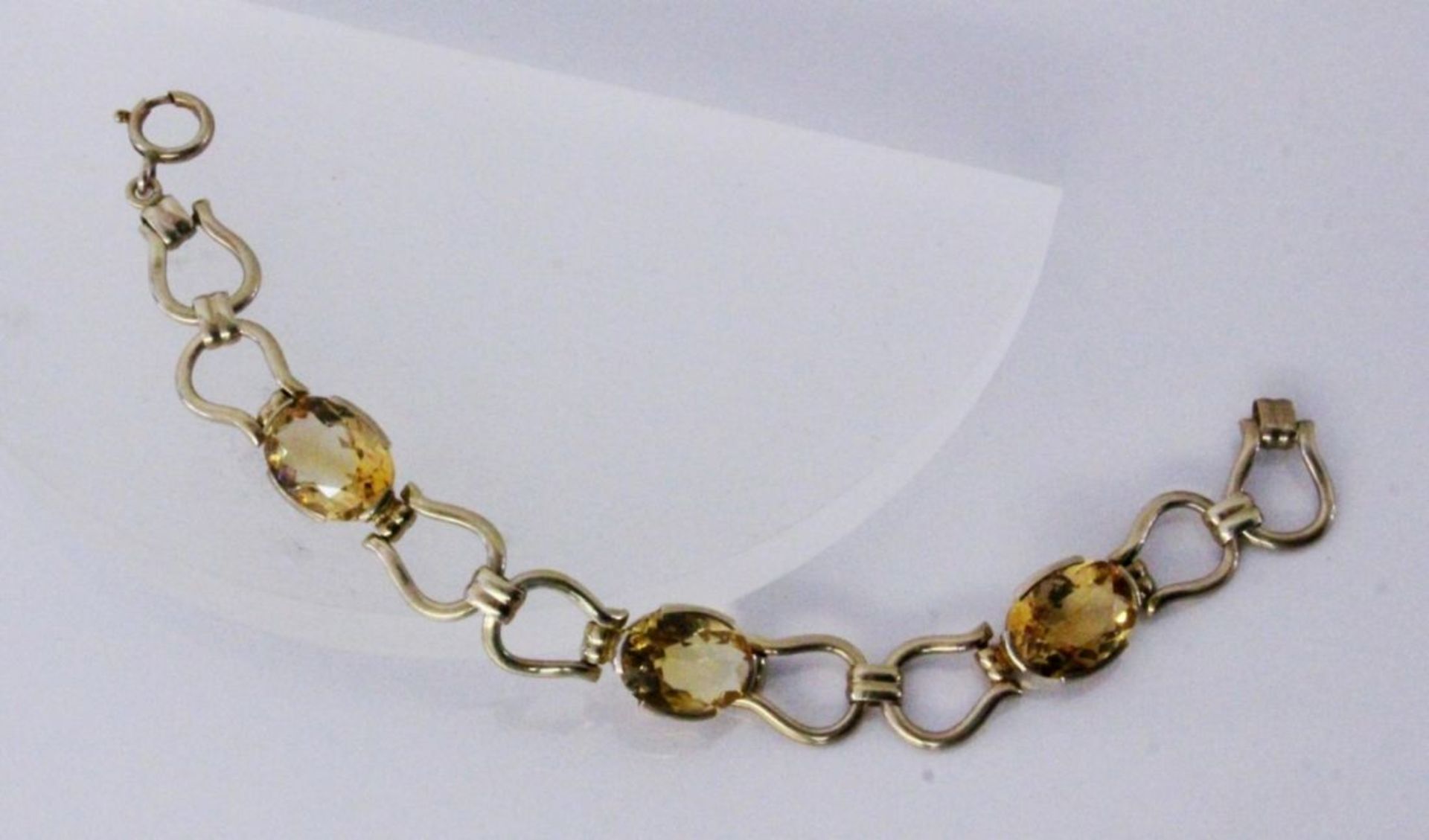 A BRACELET Silver, gold-plated with citrines. 18.5 cm long. Keywords: jewellery, piece of