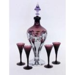 A LIQUEUR CARAFE AND 4 GOBLETS Farber & Bross, New York Purple glass with metal mount. 36