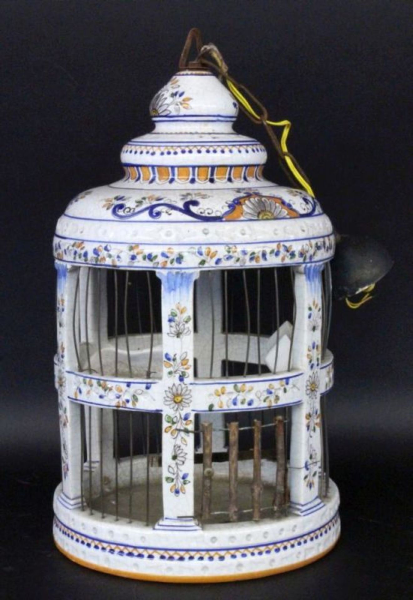 AN AVIARY AS A GARDEN LAMP Faience, painted in colour, electrified. 44 cm high. Keywords: