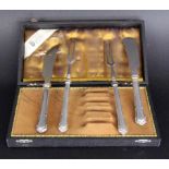 A SET OF CHEESE KNIVES AND FORKS WITH SILVER HANDLES 4 pieces, in original case. Keywords: