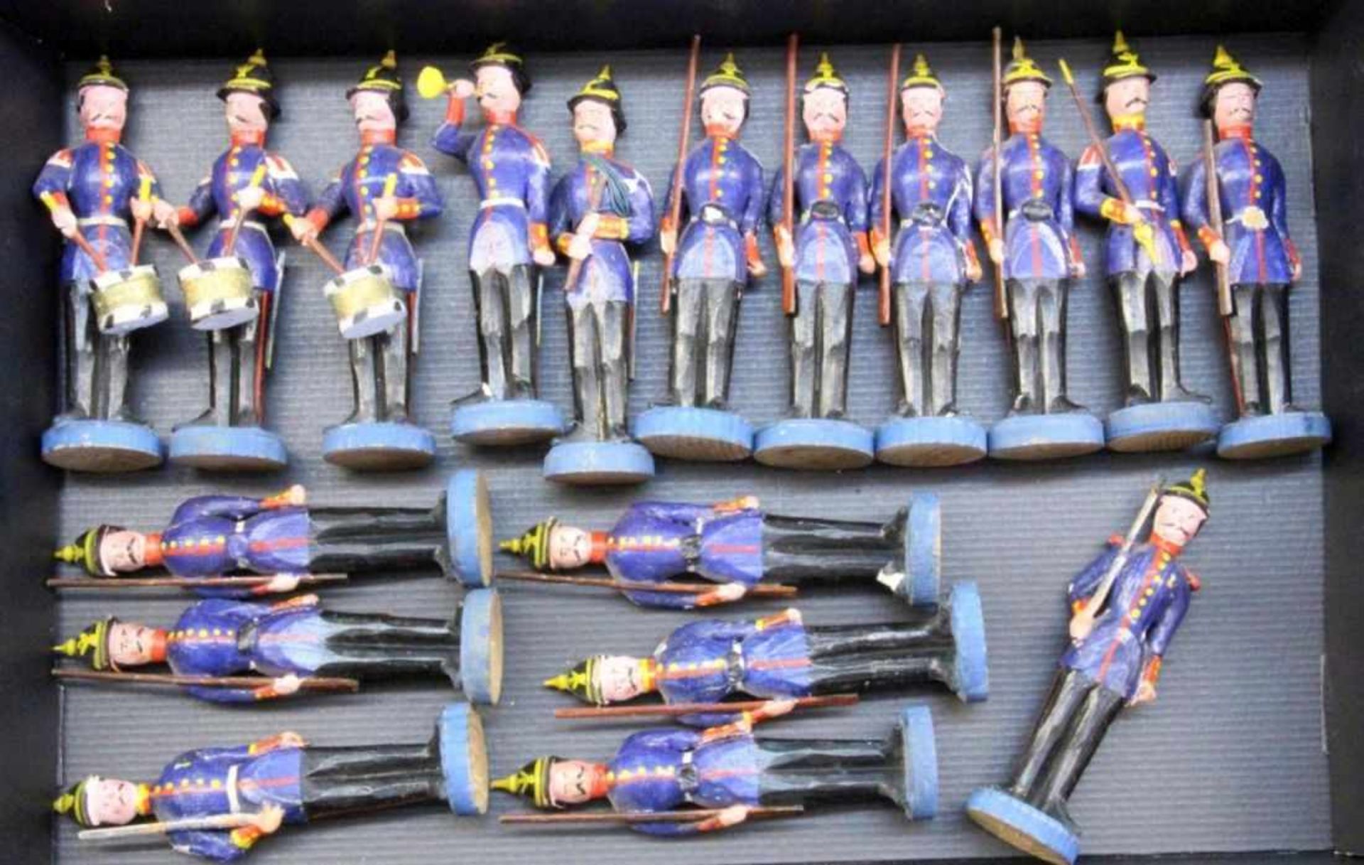 A LOT OF 18 PRUSSIAN WOODEN SOLDIERS circa 1850. Carved and painted in colour. 17 cm high.