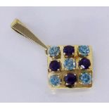 A PENDANT 585/000 yellow gold with blue zircons and amethysts. 45 mm long, gross weight