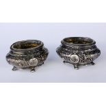 A PAIR OF SALT BOWLS France, 19th century Silver with glass inserts. 4 cm high. Keywords: