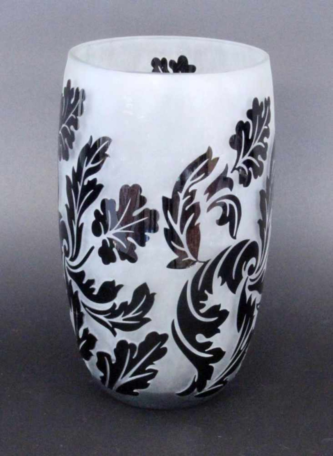 A CAMEO VASEColorless glass with black overlay and etched relief decoration all around. 25 cm