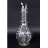 AN ELIXIR BOTTLE WITH STOPPERS divided into 4. 1 stopper missing. 33 cm high. Keywords: