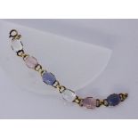 A BRACELET Silver, gold-plated with moonstones and rose quartz. 18 cm long. Keywords: