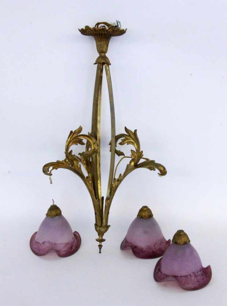 AN ART NOUVEAU HANGING LAMP Bronze frame with 4 purple veined glass shades. The wiring and