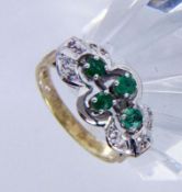 A LADIES RING 585/000 yellow gold with emeralds and brilliant cut diamonds. Ring size 52,