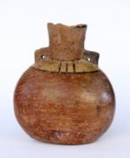 AN ANTIQUE HANDLED VASE probably China, Zhou Dynasty circa 1000 BC Brown ceramic with