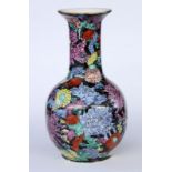 A FAMILLE NOIRE VASE China, 20th century Porcelain with lavishly painted floral decoration