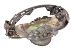 A DECORATIVE FRUIT BOWL Blackened iron frame with sculptural flowers. Inserted glass bowl