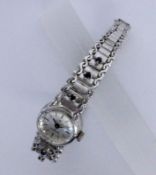A LADIES WRISTWATCH Silver with sapphires. 17.5 cm long. Gross weight approx. 42 grams.