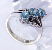 A LADIES RING 585/000 white gold with 3 blue zircons and brilliant cut diamonds. Ring size