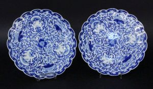 TWO PLATES China, probably Qing dynasty Flat round shape with fanned edge. Blue underglaze