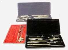 TWO COMPASSES CASES and technical drawing instruments. In original cases. Keywords: