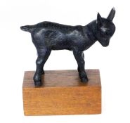 JAKOB WILHELM FEHRLE Schwabisch Gmund 1884 - 1974 Small Goat. Black patinated cast iron on wooden