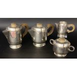 A VINTAGE TEA AND COFFEE SERVICE Silver-plated metal with wooden knobs. 4 pieces, 1 lid