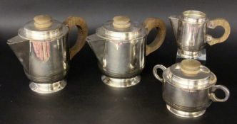 A VINTAGE TEA AND COFFEE SERVICE Silver-plated metal with wooden knobs. 4 pieces, 1 lid