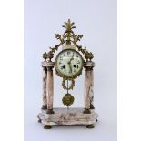 A PORTICO CLOCK France, late 19th century Grey spotted marble. Gilt brass case with bronze fittings.