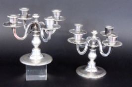 A PAIR OF CANDLESTICKS Erquis, Paris A pair of 4-light candlesticks made of silver-plated metal.