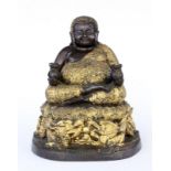 A FAT BUDDHA China, 20th century Buddai figure (god of wealth) sitting on a lotus thronewith 2