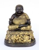 A FAT BUDDHA China, 20th century Buddai figure (god of wealth) sitting on a lotus thronewith 2