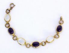 A BRACELET Silver, gold-plated with moonstone and amethyst cabochons. 18 cm long.