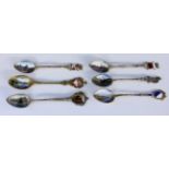 A LOT OF 6 SOUVENIR SPOONS silver, partly gilt, mostly with enamelled views and coat ofarms from