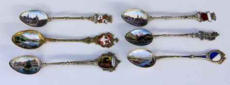 A LOT OF 6 SOUVENIR SPOONS silver, partly gilt, mostly with enamelled views and coat ofarms from