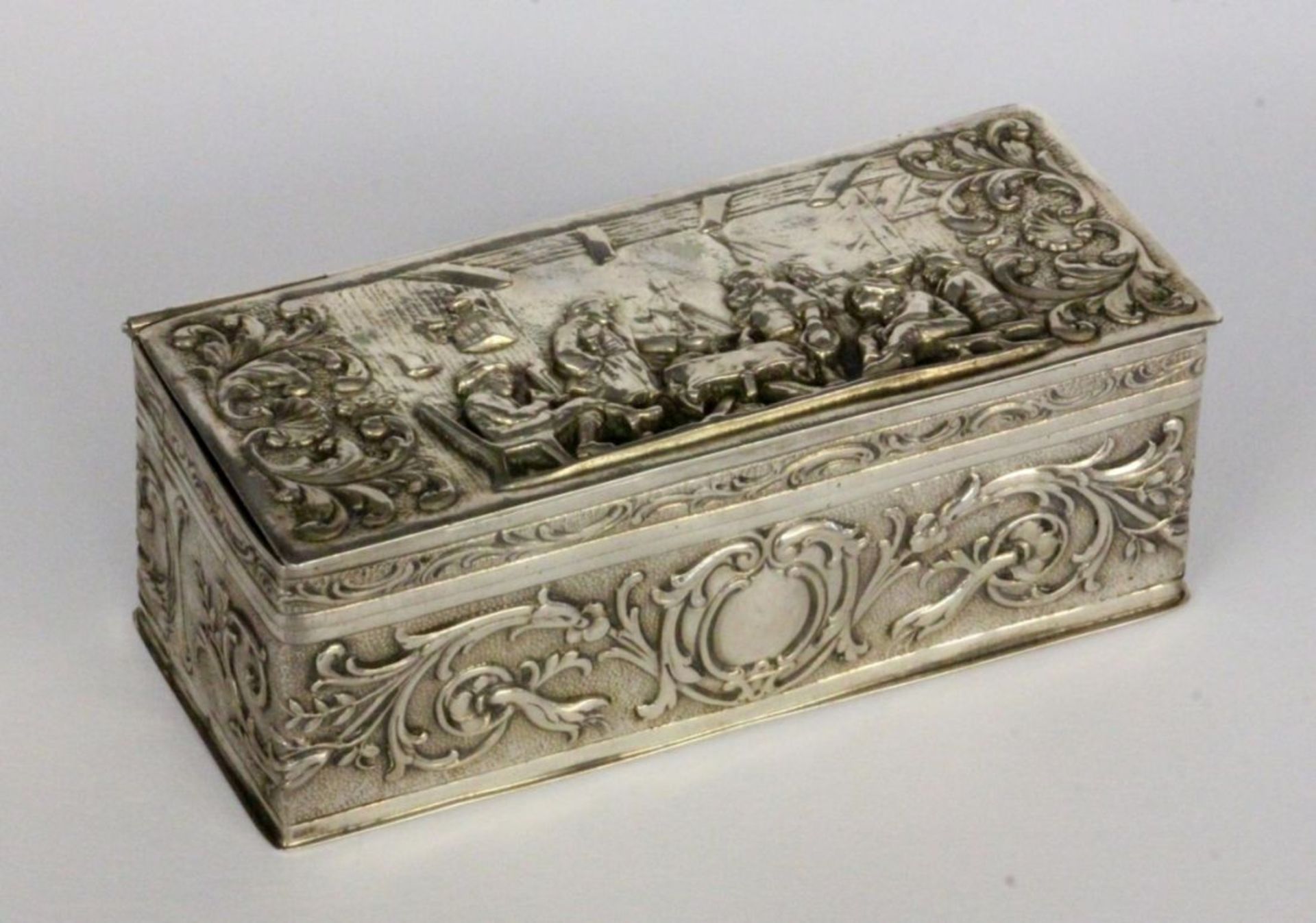 A SILVER TOBACCO BOX German circa 1900 800/000 silver with gilt interior. Rectangular