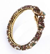 AN INDIAN SNAKE BRACELET Gilt brass with finely sawn decoration. Set with numerous pearls