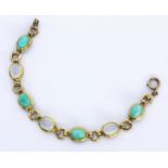 A BRACELET Silver, gold-plated with moonstone and amazonite cabochons. 18 cm long.