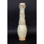 A VASE China, probably Yuan dynasty 1206-1368 Slim cone shape with figural reliefdecoration (Ying