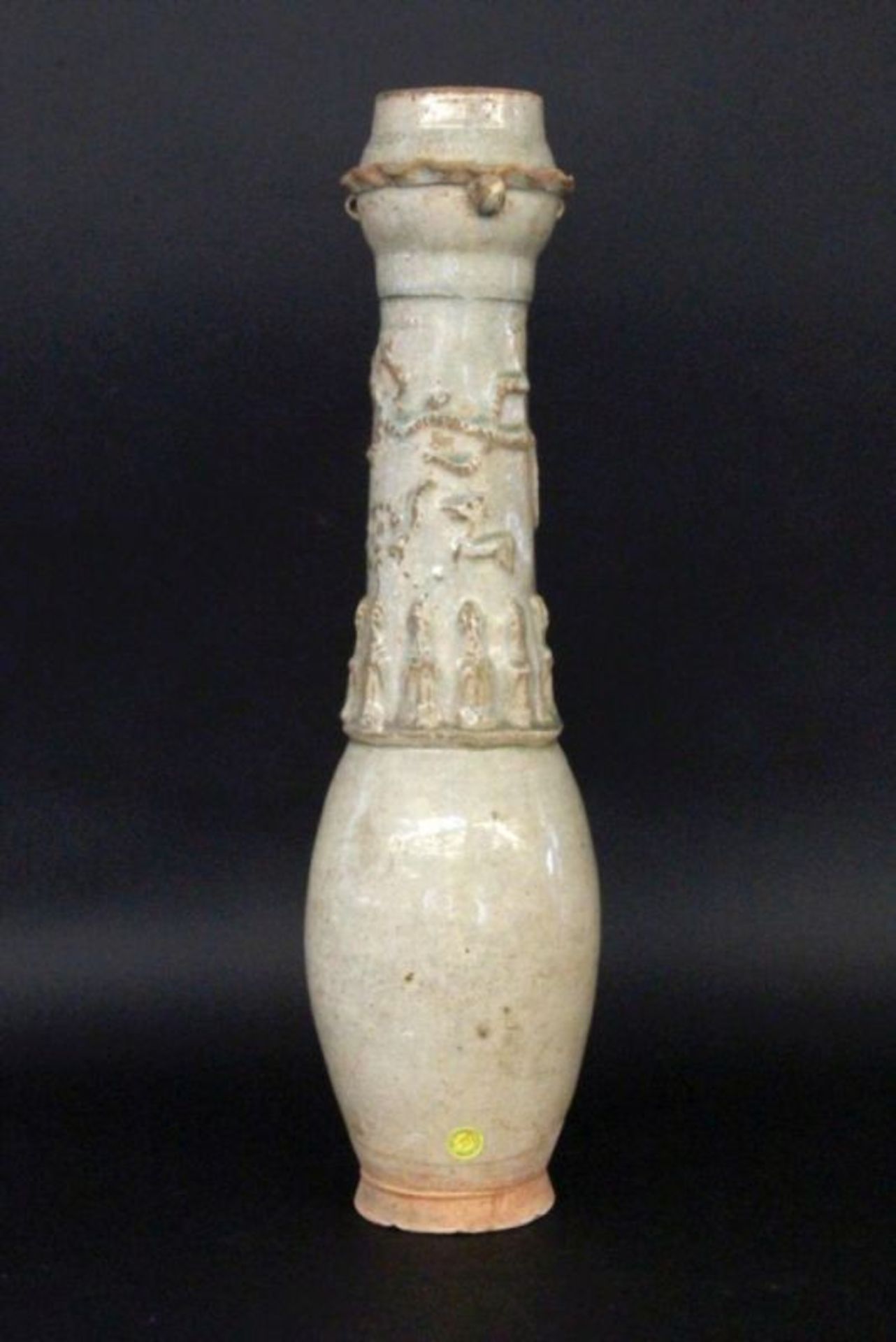 A VASE China, probably Yuan dynasty 1206-1368 Slim cone shape with figural reliefdecoration (Ying